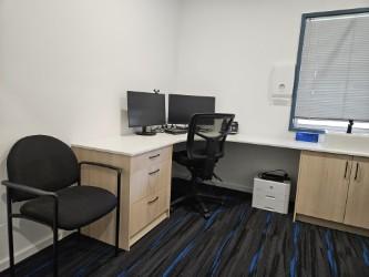 Consulting room with desk workstation at Employment Medicine