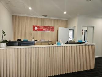Employment Medicine reception desk and brand wall at Parafield